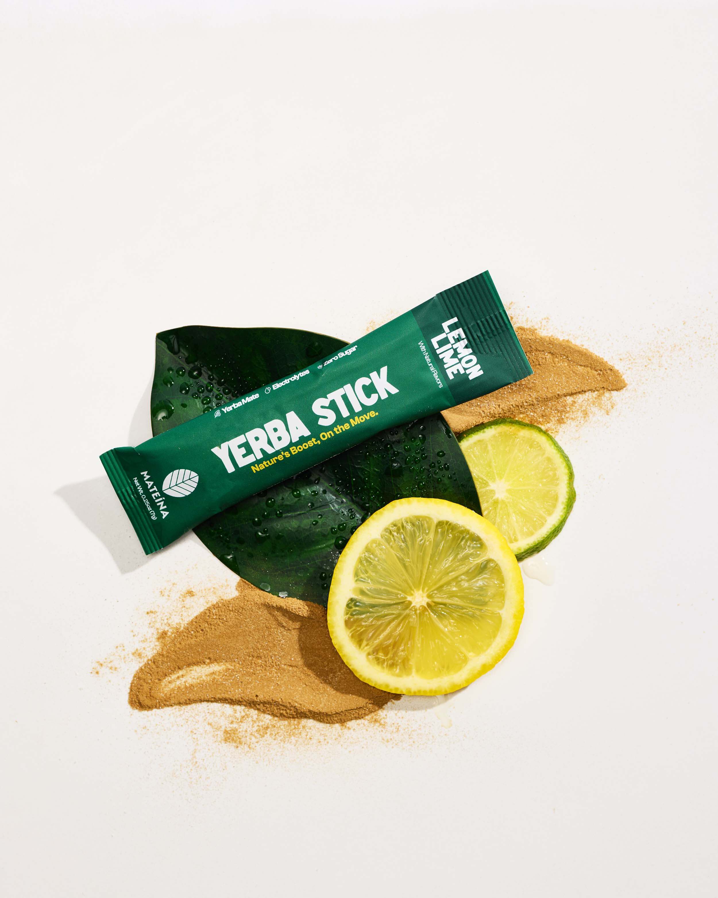 Yerba Mate + Electrolytes - Lemon Lime stick with lemon slices and green leaves, showcasing refreshing energy.
